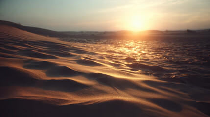 Fototapeta premium Golden sand dune landscape with warm sunlight at sunset