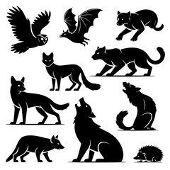 Fototapeta premium Collection of stylized black silhouettes of nocturnal animals including owls bats wolves foxes and a hedgehog on a white background