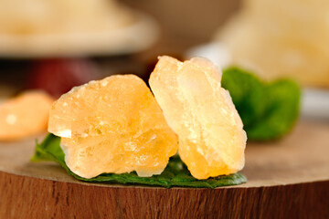 Handmade old-fashioned large-grain yellow icing sugar cane production highlights traditional...