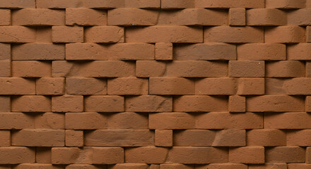 Textured red brick wall with a repeating geometric pattern