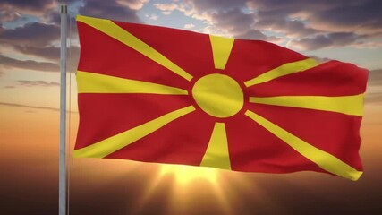 flag waving against stunning sunset backdrop. vibrant red and yellow design symbolizes national pride and unity. travel, cultural celebration. north macedonia independence day
