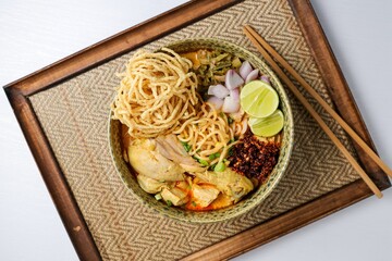 Northern thai curry Noodles with chicken on white background , Thai called  khao soi kai ,Northern food of thailand