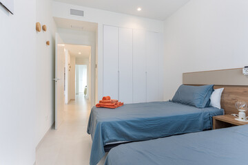 Bedroom with built-in wardrobe and hallway view