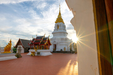 Phra Chaiyaphum Siri Maha Chedi (Arun Dhamma Sathan), which is located in Chaiyaphum, Thailand, is famous place in view under blue sky and sunset clouds. 