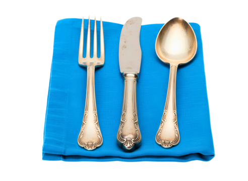 Silver fork and knife resting on a blue napkin isolated on transparent background