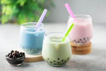 Different Healthy vegan drink Matcha  Latte  with Boba or Tapioca pearls in glasses. Bubble tea concept