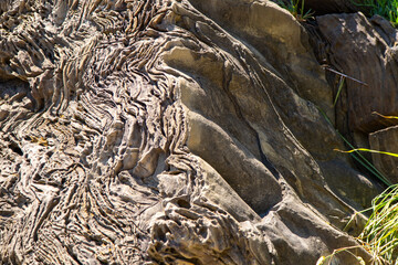 Close up of rock, folded stone nature background. Erosion of the Mountains