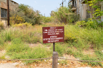 Warning signs such as forbidden zone, building may collapse in the abandoned city Varosha in...