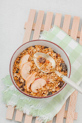 Vegan bowl with cereal granola with dried fruits. Ready to eat food, healthy breakfast concept