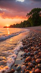 Obraz premium A scenic view of a rocky beach at sunset with waves gently lapping the shore and a colorful sky above