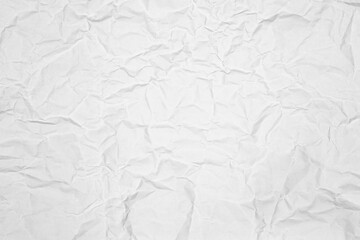 White crumpled paper texture background. Abstract wrinkled and creased craft paper for a vintage or grunge design surface.