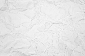 White crumpled paper texture background. Abstract wrinkled craft page for design, mockup, or overlay. Full frame, top view.
