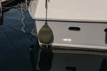 fenders on sailing boat, yacht protection at marine and harbour