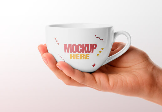 Cup Held by Hand Mockup