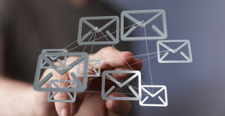 Hand interacting with a network of email icons, symbolizing global communication and digital connectivity.