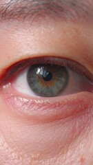 A clean and simple macro shot of an Asian woman's eye