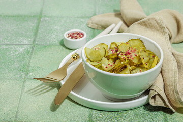 Fermented cucumbers in a bowl. Healthy gut food, natural probiotic superfoods, organic pickles