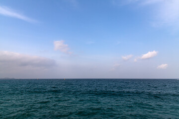 tranquil seascape with calm sea and clouds