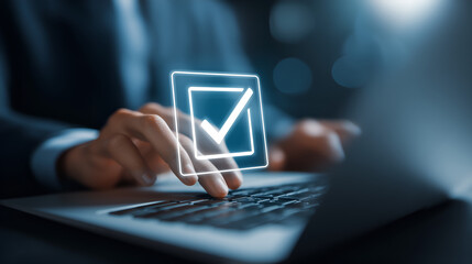 Digital Task Completion: A close-up shot of a person's hands typing on a sleek laptop keyboard, overlaid with a glowing checkmark icon, indicating task completion, validation, or approval.