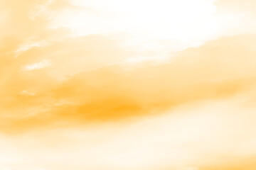 Obraz premium Abstract textured background with warm golden hues and dark shadows creating a moody and atmospheric visual