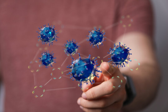 A hand interacts with a digital model showing a network of viruses.  Healthcare, science, technology. - Powered by Adobe