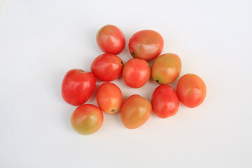 Fresh tomatos on white studio background. Top view.