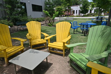 Yellow and green chairs on green grass