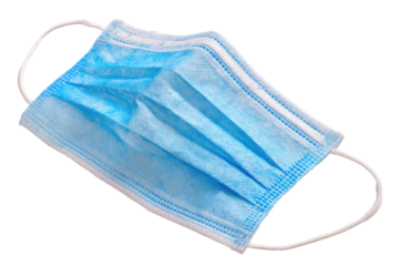 Light-blue disposable face mask, folded, with white ear loops, isolated on black