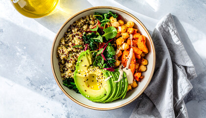 Vibrant healthy bowl with quinoa, chickpeas, avocado, and kale.