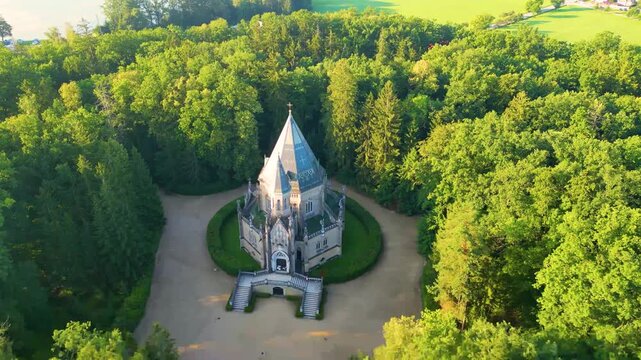 The majestic Schwarzenberg tomb stands amid lush greenery in Domanin, near Trebon, showcasing intricate architecture and serene surroundings that reflect its historical significance.