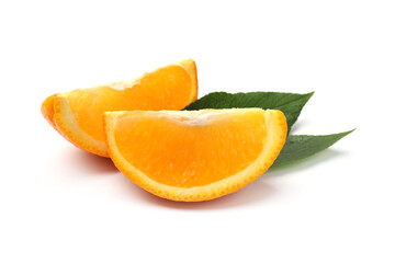 Slices of juicy orange and green leaves isolated on white