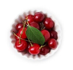 Yummy ripe red cherries in bowl isolated on white, top view