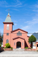 Pink church standing tall in chile's patagonia region