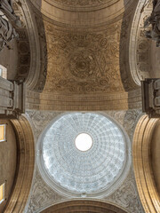Exploring El Sagrario Church's ornate ceiling in Seville