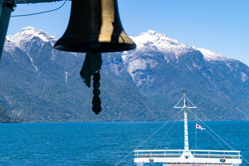 Ferry bell ringing with chilean patagonia mountains in background