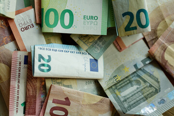 Close up of various euro banknotes, showing different denominations.