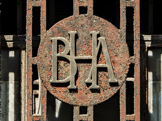 Rusty bank logo in Seville reflects Spain's financial past