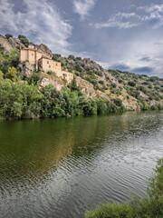 Fototapeta premium San Saturio Hermitage reflects in the Duero River in Soria