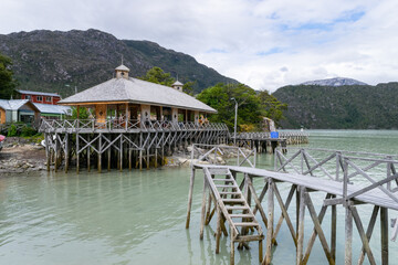 Wooden pier and building on stilts in caleta tortel, chilean patagonia