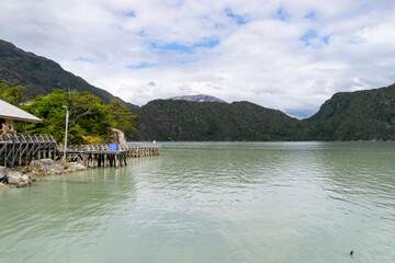 Wooden pier stretching into the tranquil waters of patagonia, chile
