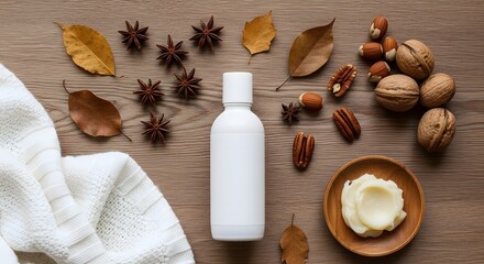 White bottle with star anise leaves and nuts on a wooden surface