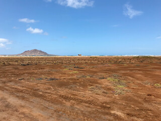 Scenic view of Cape Verde’s vibrant red earth contrasted sharply with the clear blue sky, highlighting the island’s unique and striking natural landscape