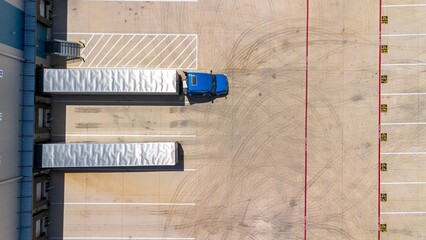 Overhead shot of truck and trailer on warehouse loading dock