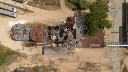 aerial view of old factory with rusted rooftops