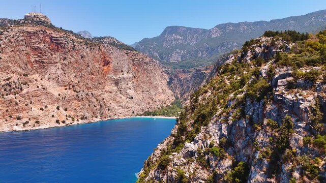 Spectacular bare rock with unapproachable cliffs. Drone footage above the Mediterranean Sea surrounded in Turkey.