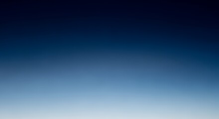 Blue gradient sky background with smooth transition from light to dark