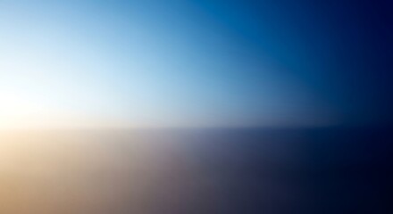 Obraz premium Blurred abstract background of a sunset over the ocean horizon
