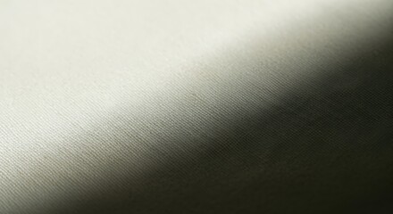Obraz premium Cream fabric texture with a soft diagonal light and shadow