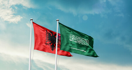 Albania and Saudi Arabia friendship flags are waving in the sky. Two country flag for agreement or deal. Albania KSA national flag for commitment.