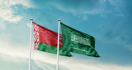 Belarus and Saudi Arabia friendship flags are waving in the sky. Two country flag for agreement or deal. Belarus KSA national flag for commitment.